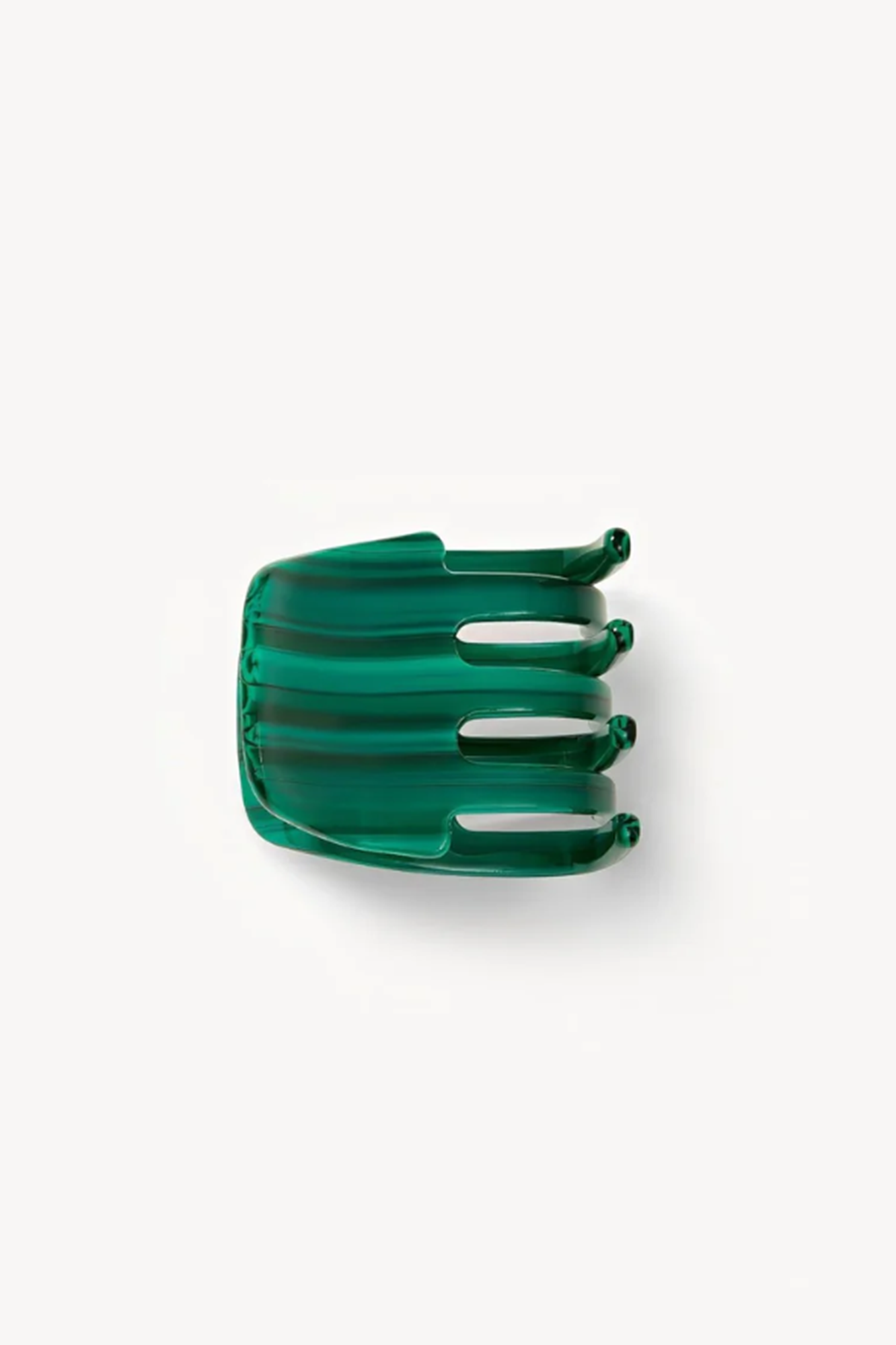 side view of a Malachite or Green hair clip or clae on a white background