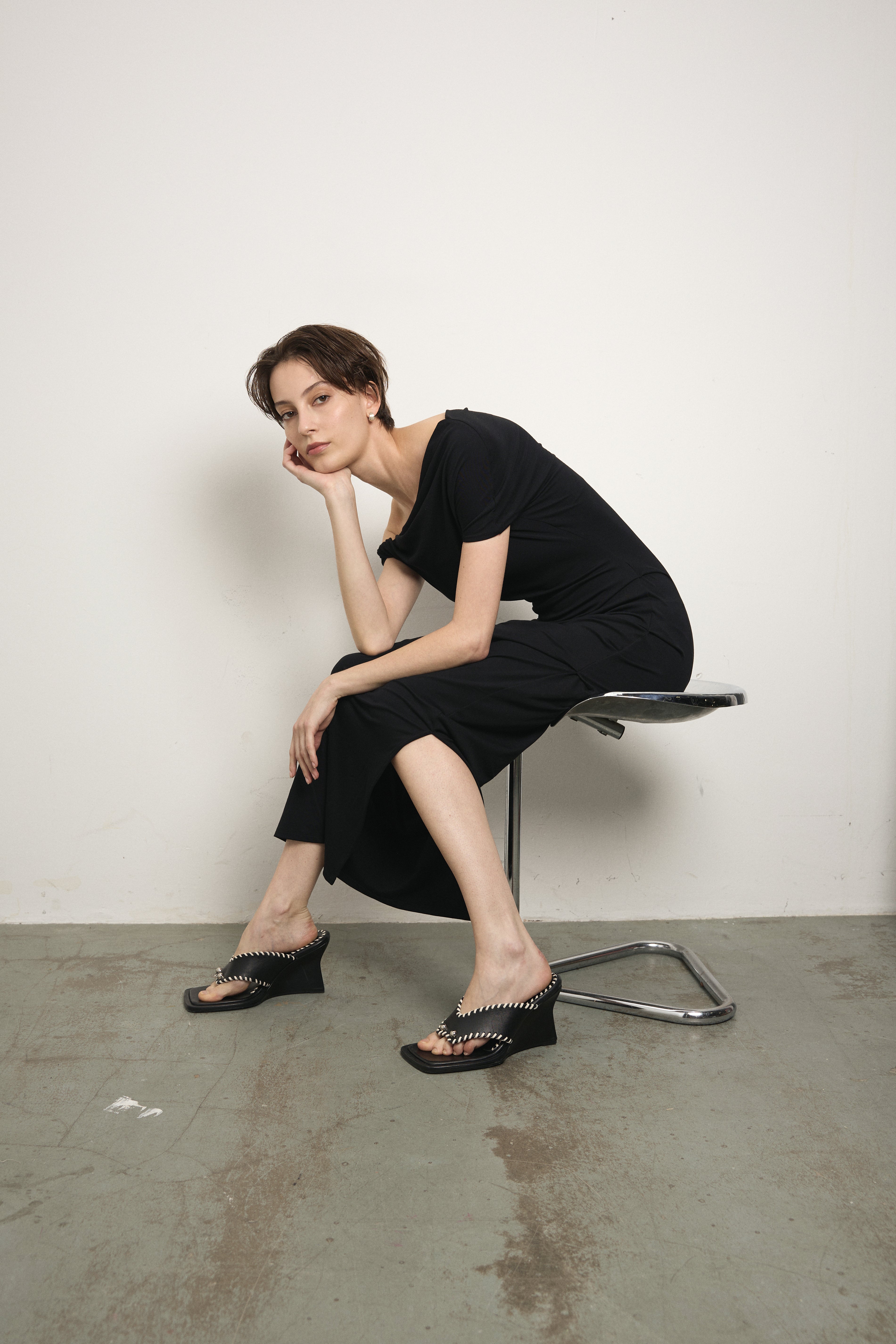 image of a woman wearing the Paris Georgia Ida dress in black 