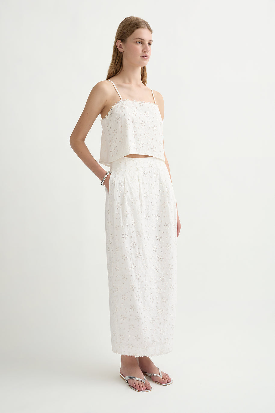 image of a model wearing the posse salma column skirt in vintage white