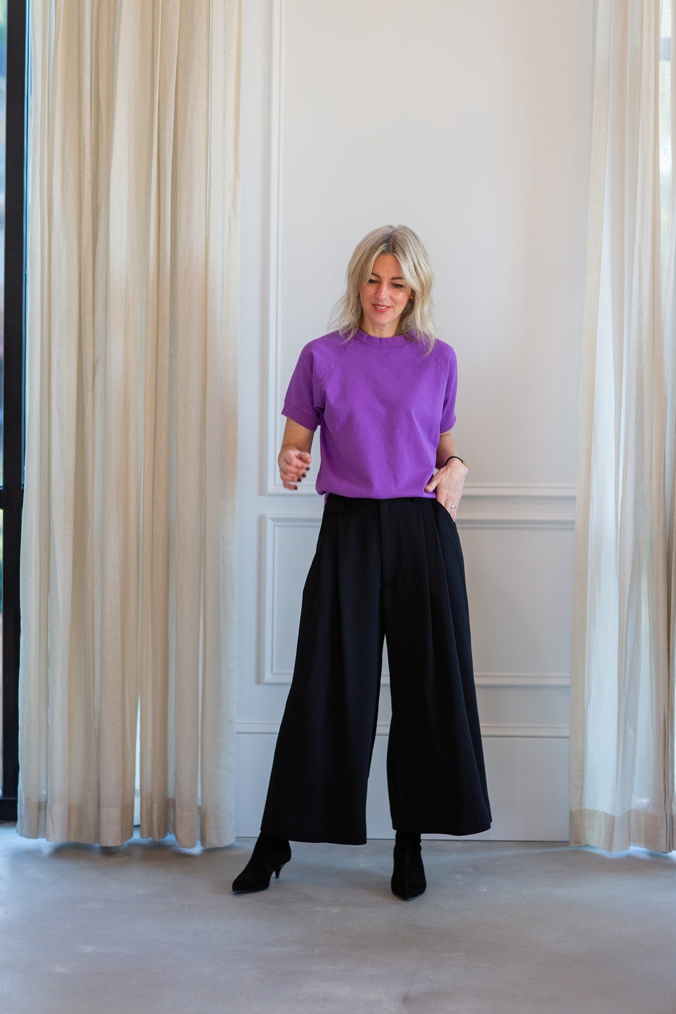 model wearing the rachel comey billi sweatshirt and wolcott pants
