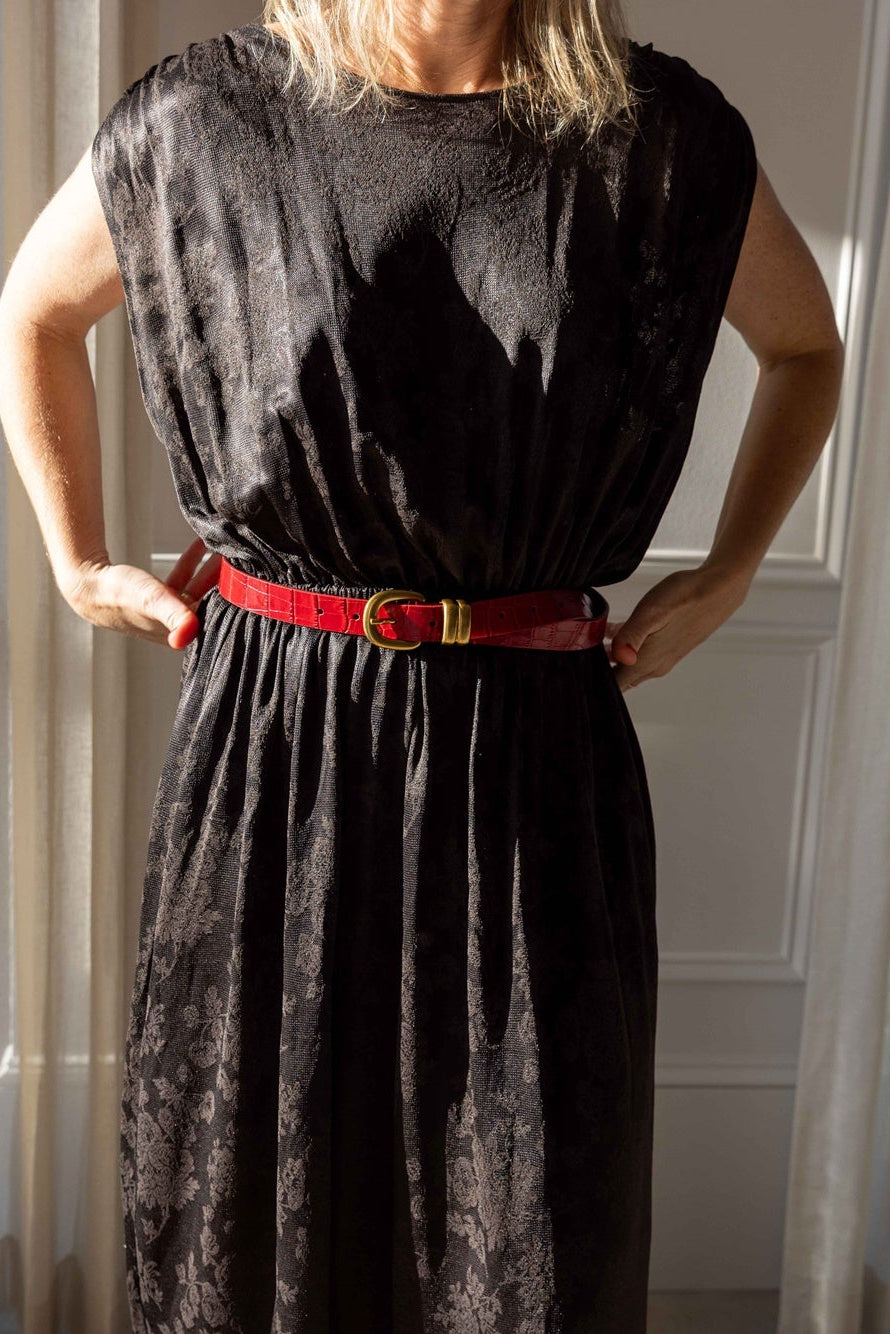 by Malene Birger Zoilo Belt in Red Dahlia leather with gold-tone buckle, cinching a dark jacquard Rachel Comey dress