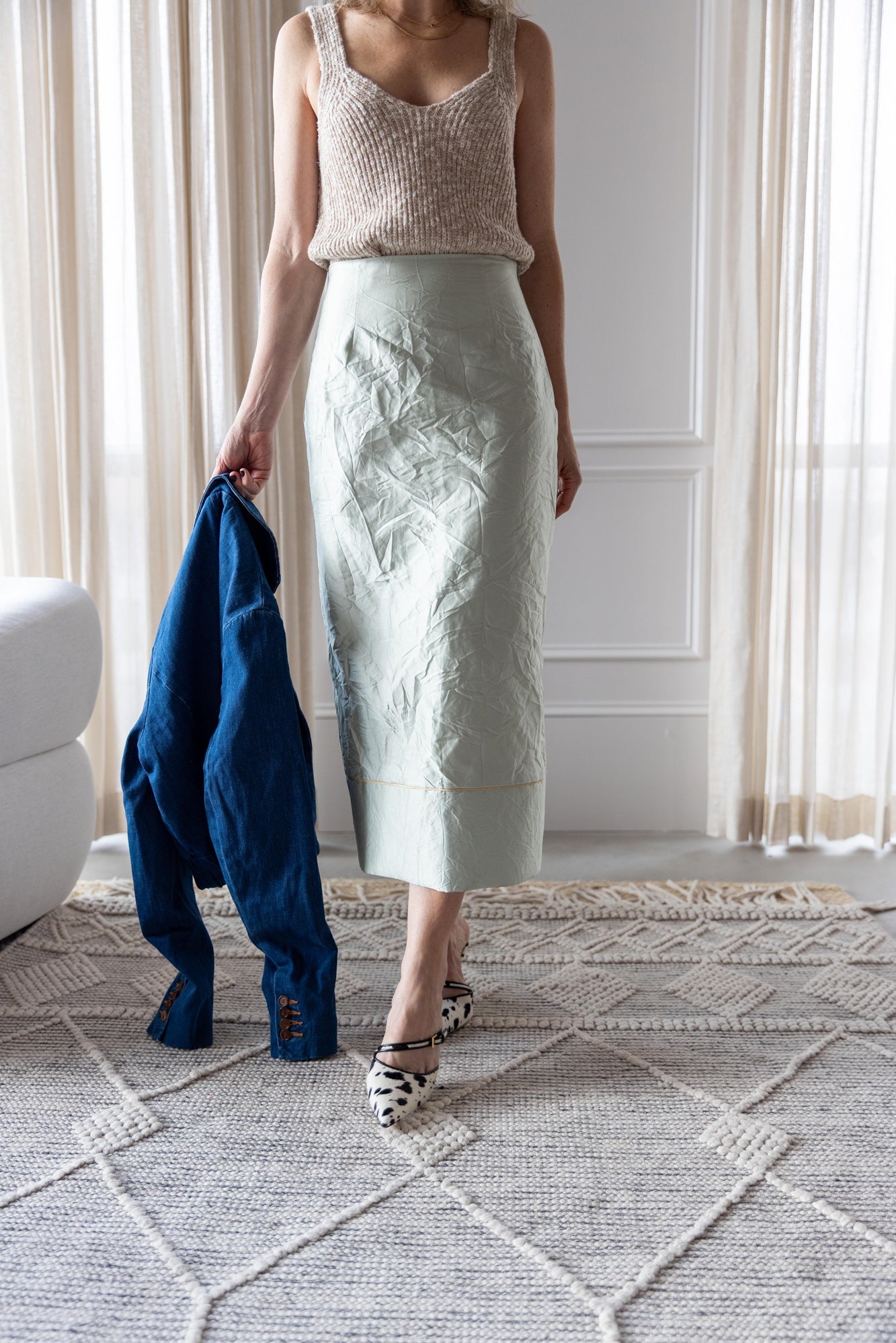 image of a woman wearing the Amo Romy Knit Tank and Rachel Comey Vick Skirt