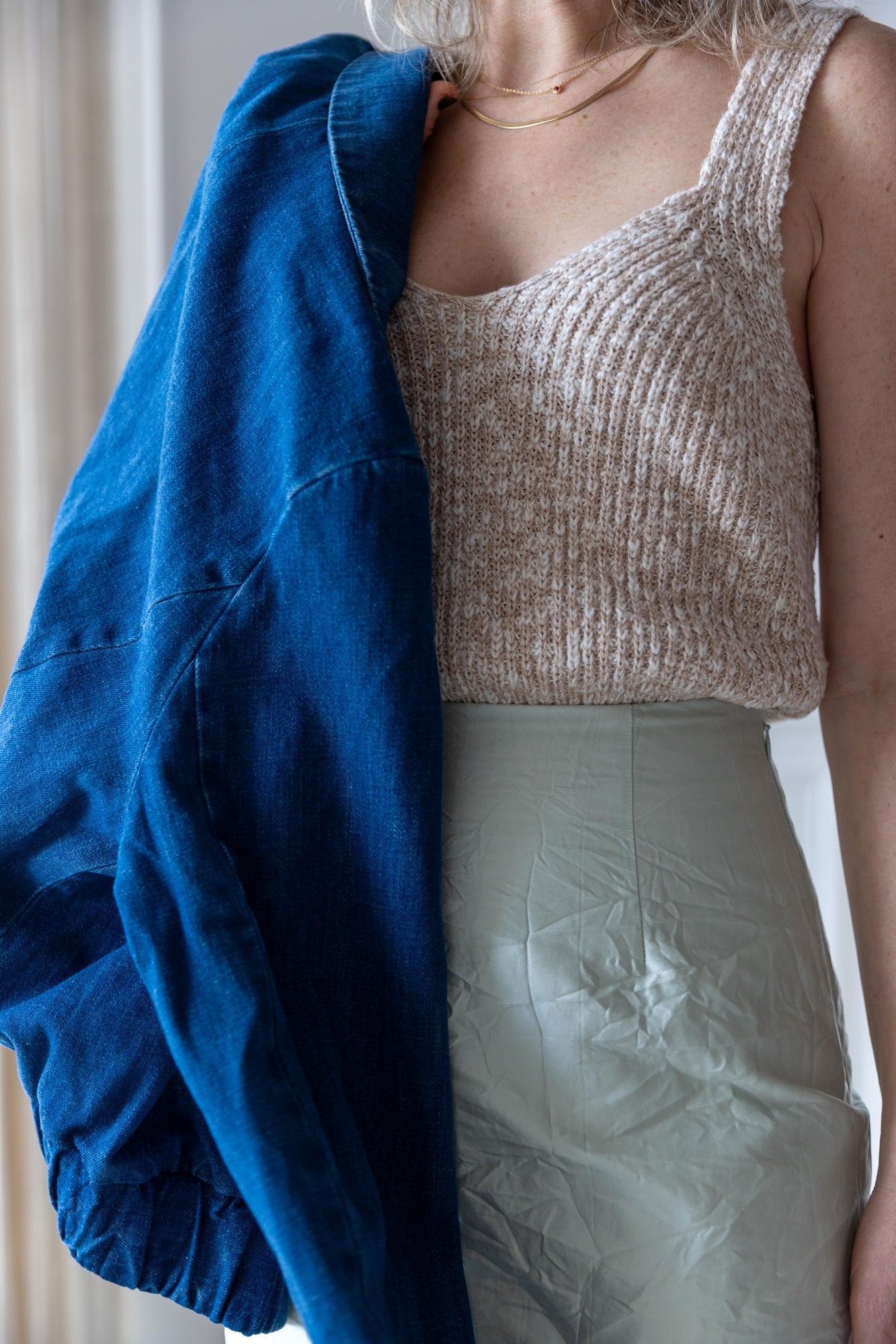 image of a woman wearing the Amo Romy Knit Tank and Rachel Comey Vick Skirt