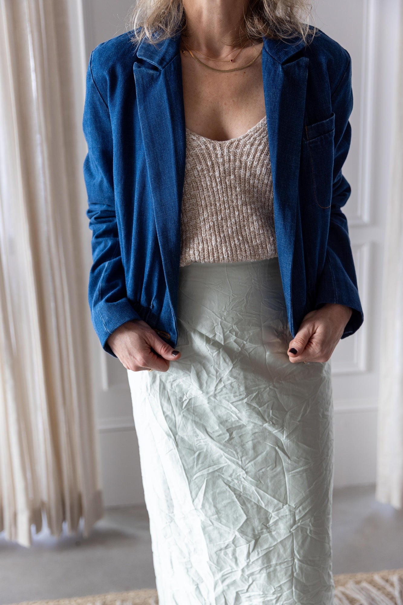 close up image of a woman wearing the Rachel Comey Grain Jacket and Vick skirt with the Amo Romy Knit Tank