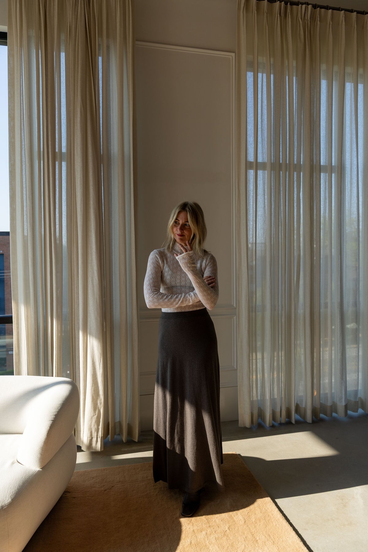 Lisa Yang Adrienne Skirt in deep walnut, full-length A-line drape, with a Sablyn Rhea turtleneck