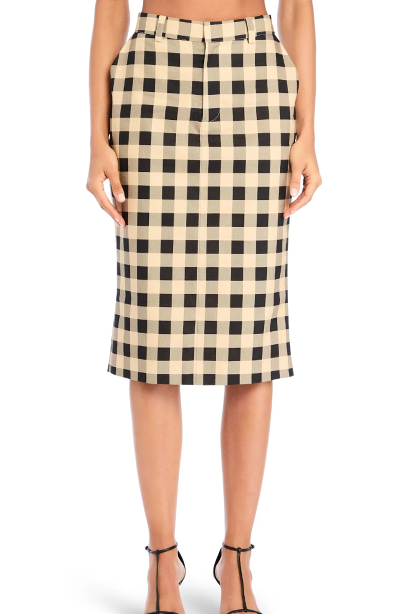 Checkered skirt worn by a person on a white background
