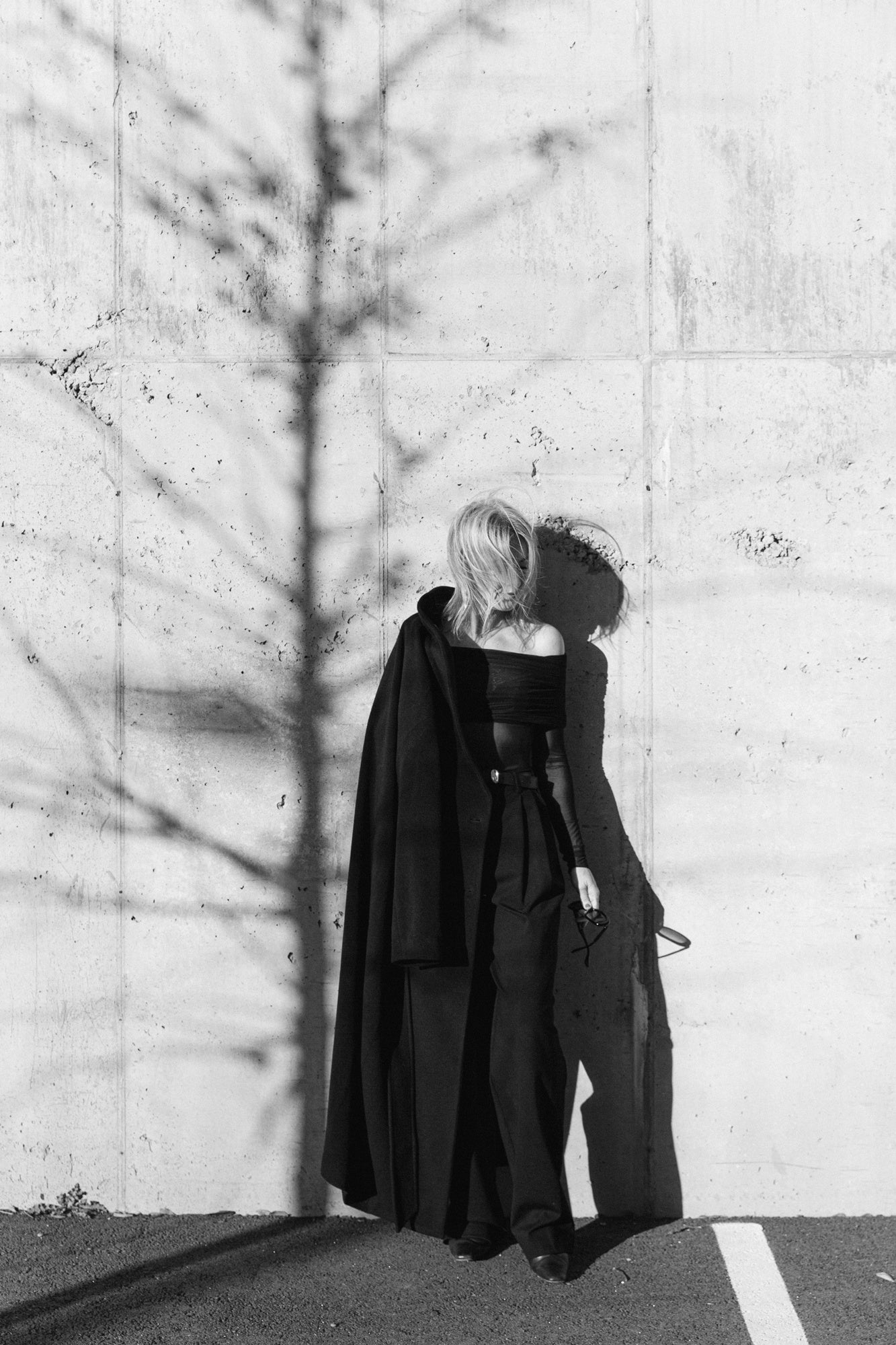 image of a woman wearing the house of dagmar coat and seroya rosa top and sonya pants