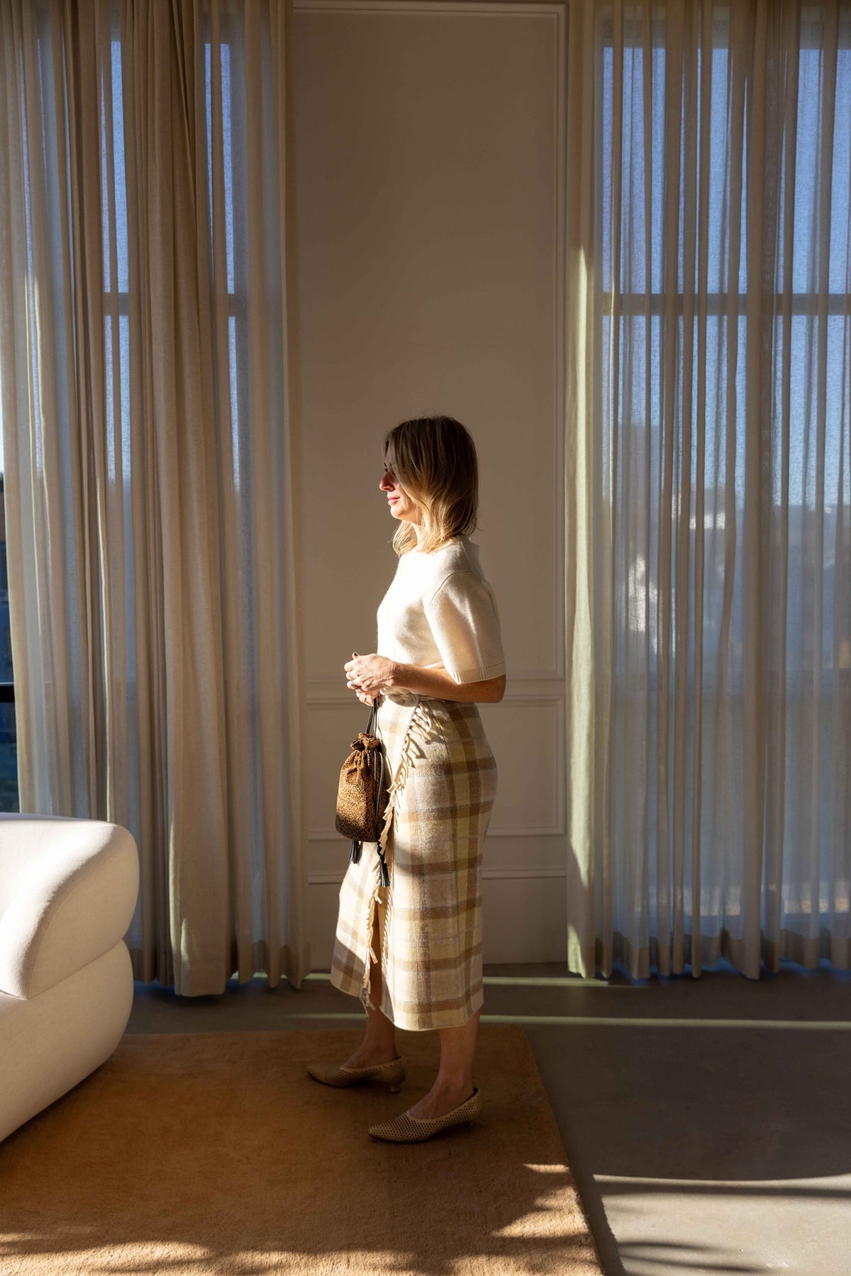 Guest in Residence Tartan Wrap Skirt styled with a Guest in Residence Soft Goat sweater and Hunting Season handbag, view 1