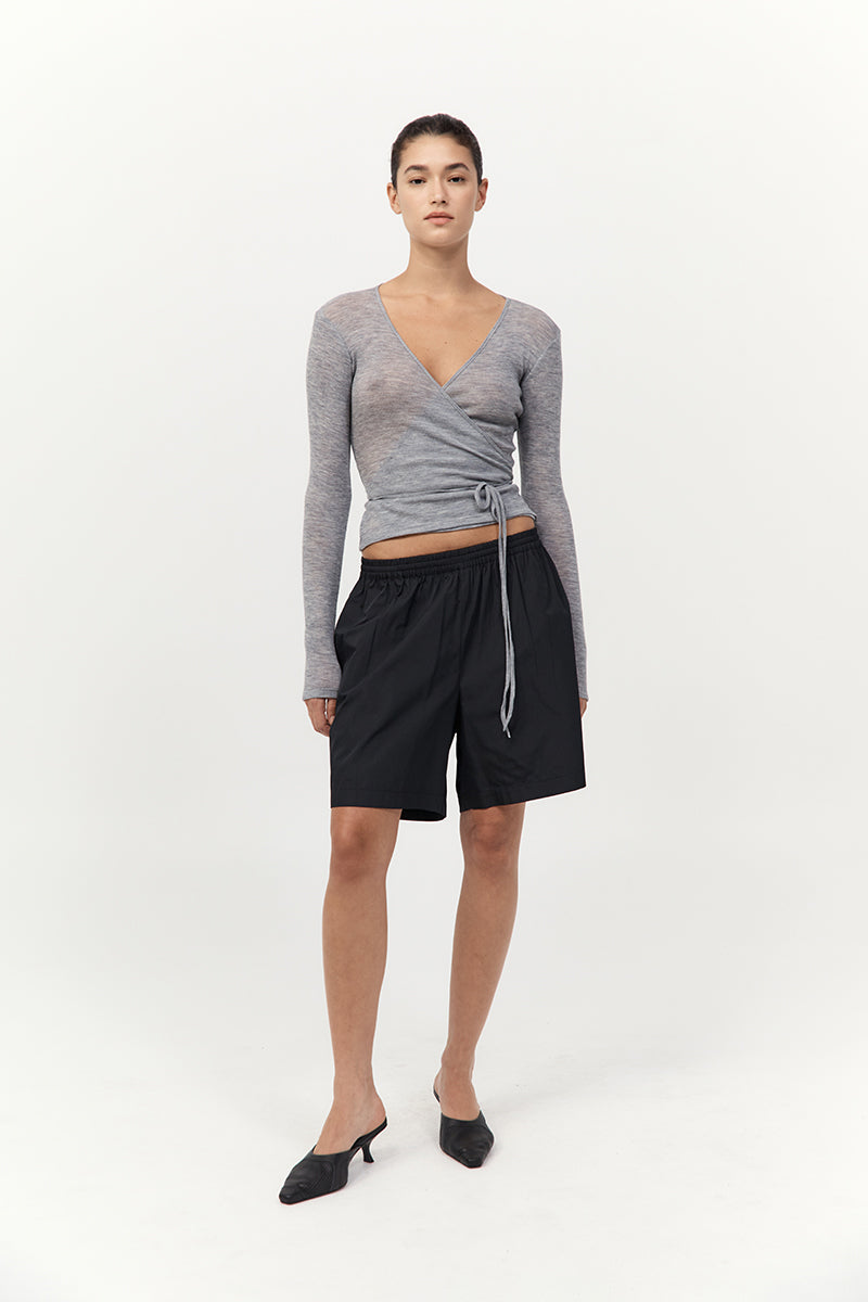 model wearing the St Agni baby wool wrap top