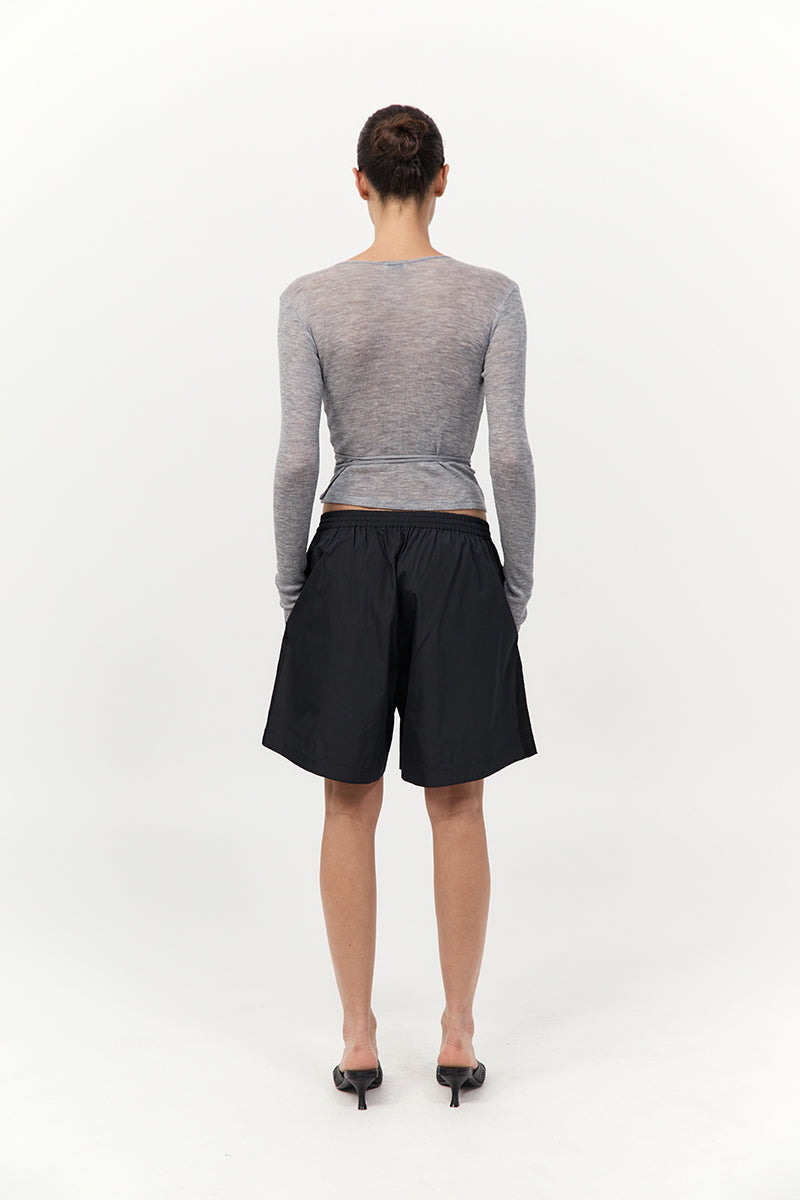 model wearing the St Agni baby wool wrap top