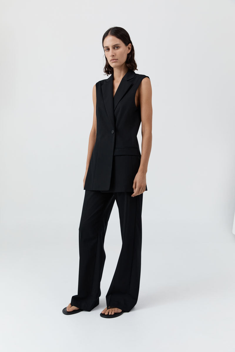 image of a model wearing the st agni sleeveless split blazer