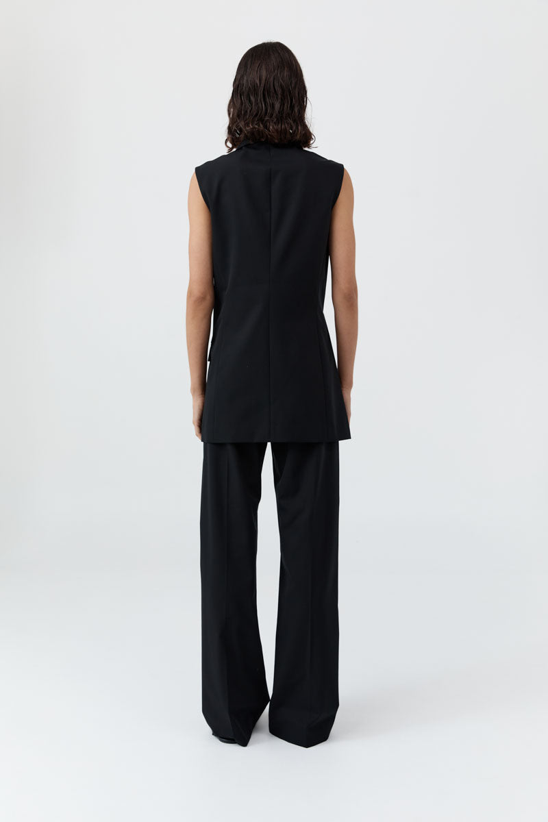 image of a woman wearing the st agni sleeveless split blazer