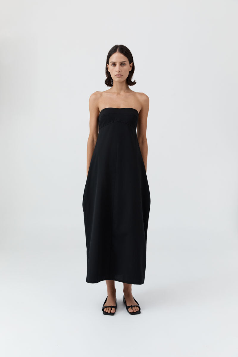 image of a model wearing the st agni wool strapless cocoon dress