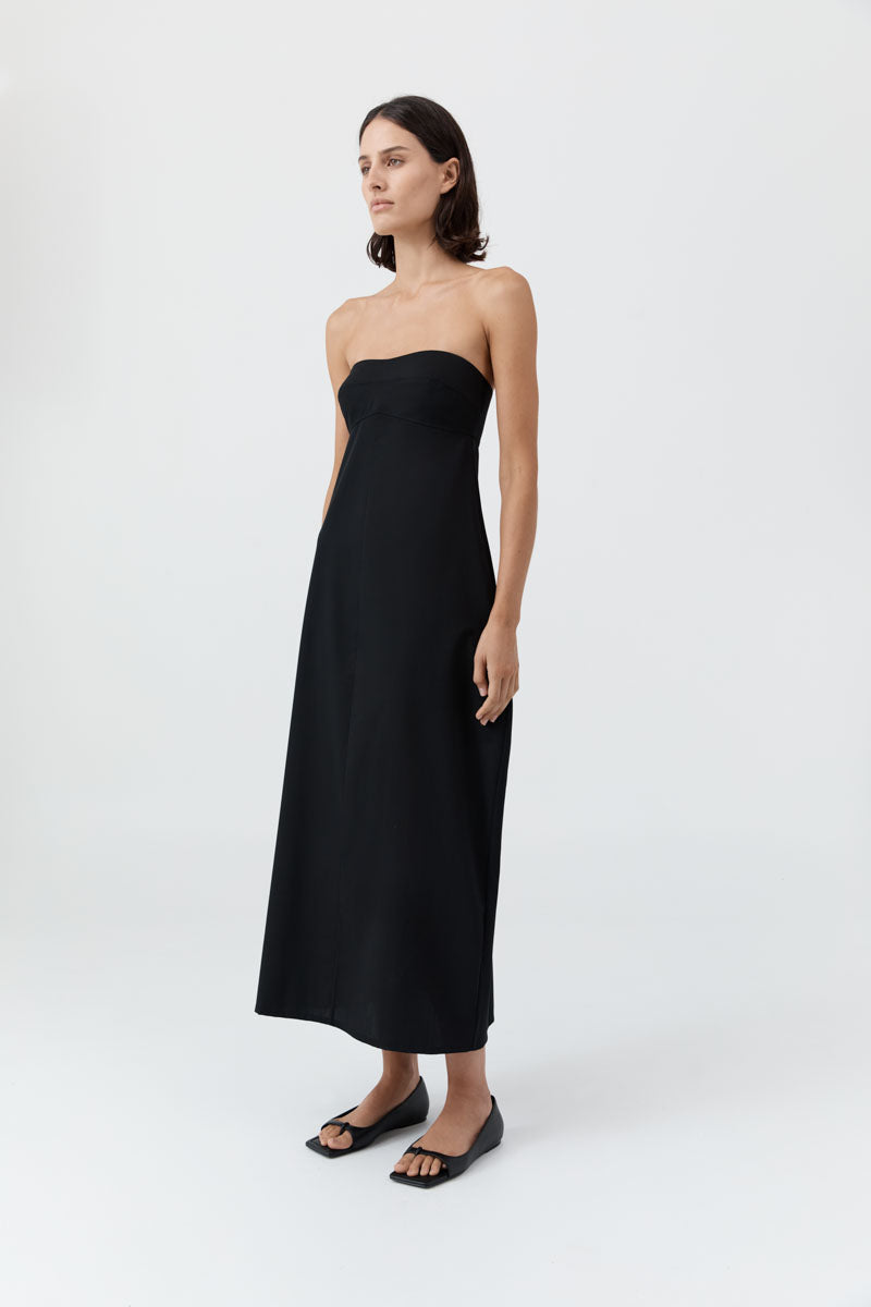 image of a woman wearing the st agni wool strapless cocoon dress