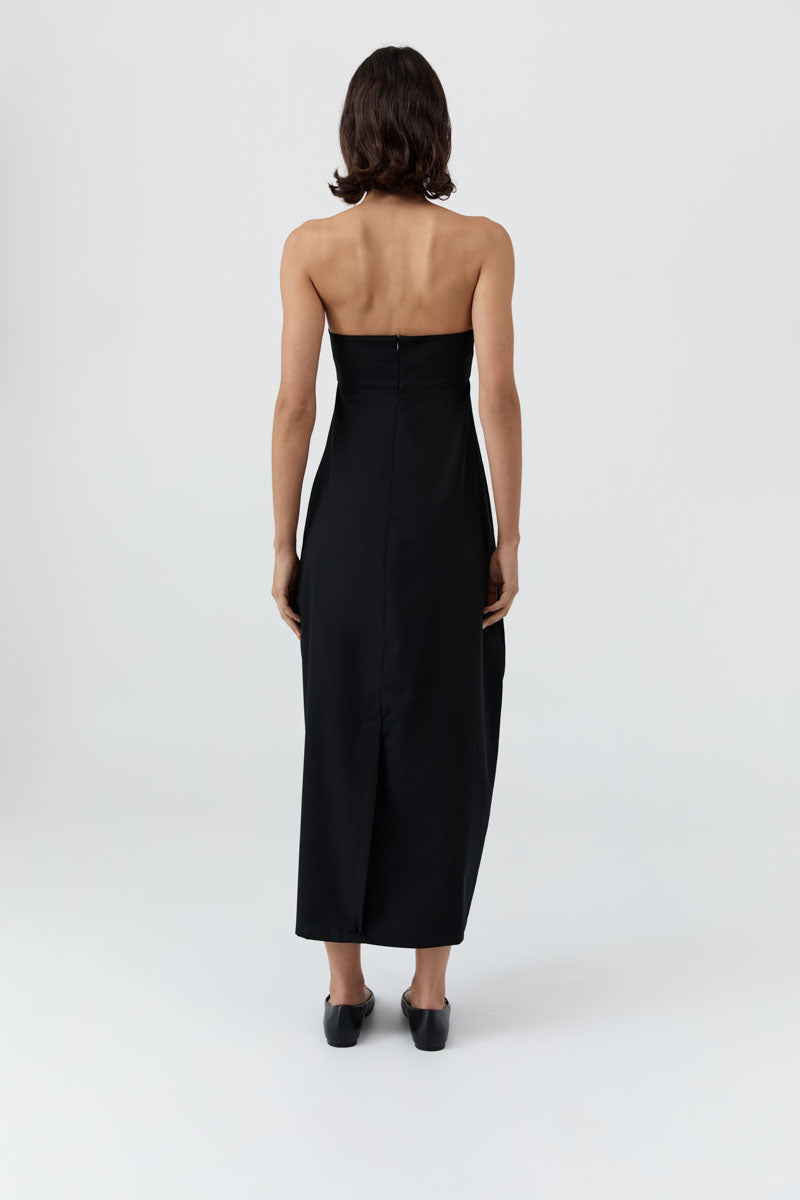 image of a woman wearing the st agni wool strapless cocoon dress