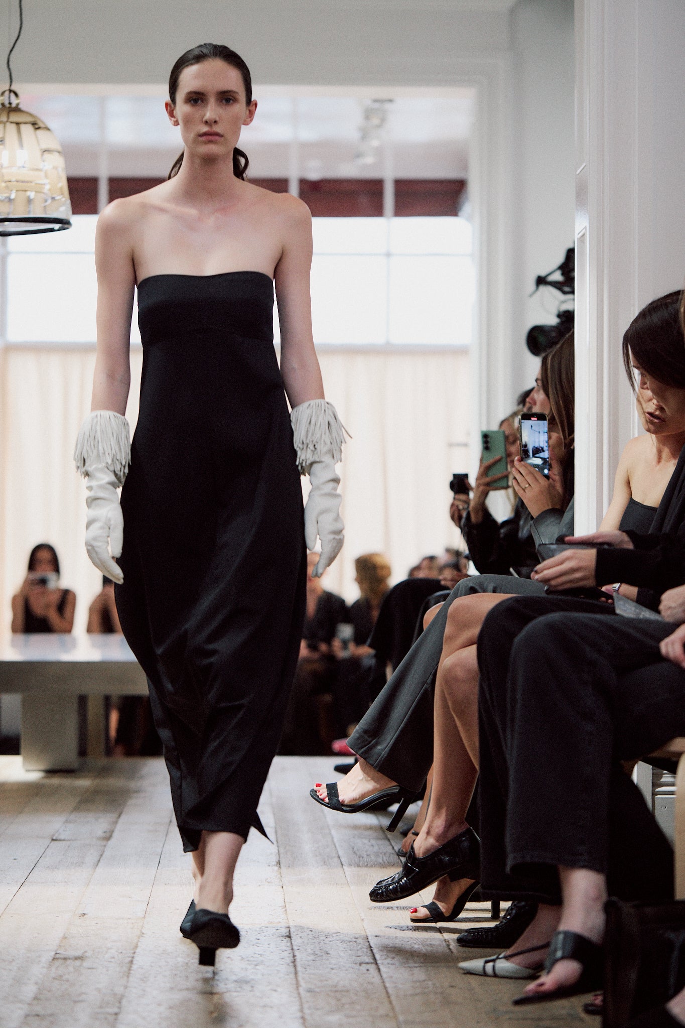 image of a model wearing the st agni wool strapless cocoon dress