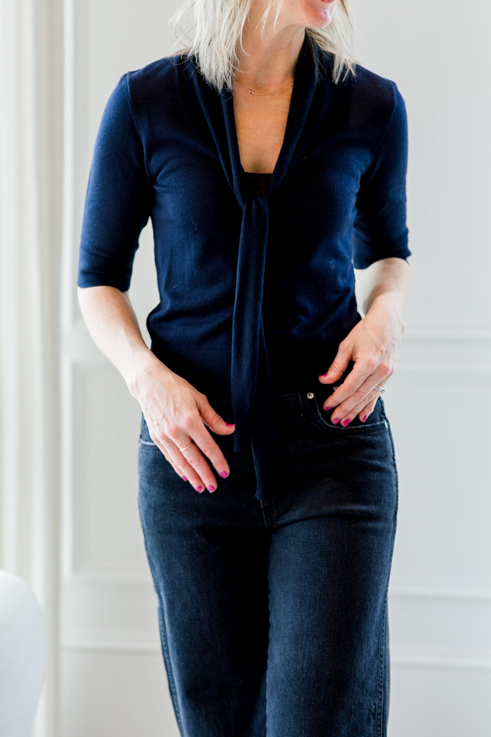 image of a woman wearing the garment bergen scarf knit top