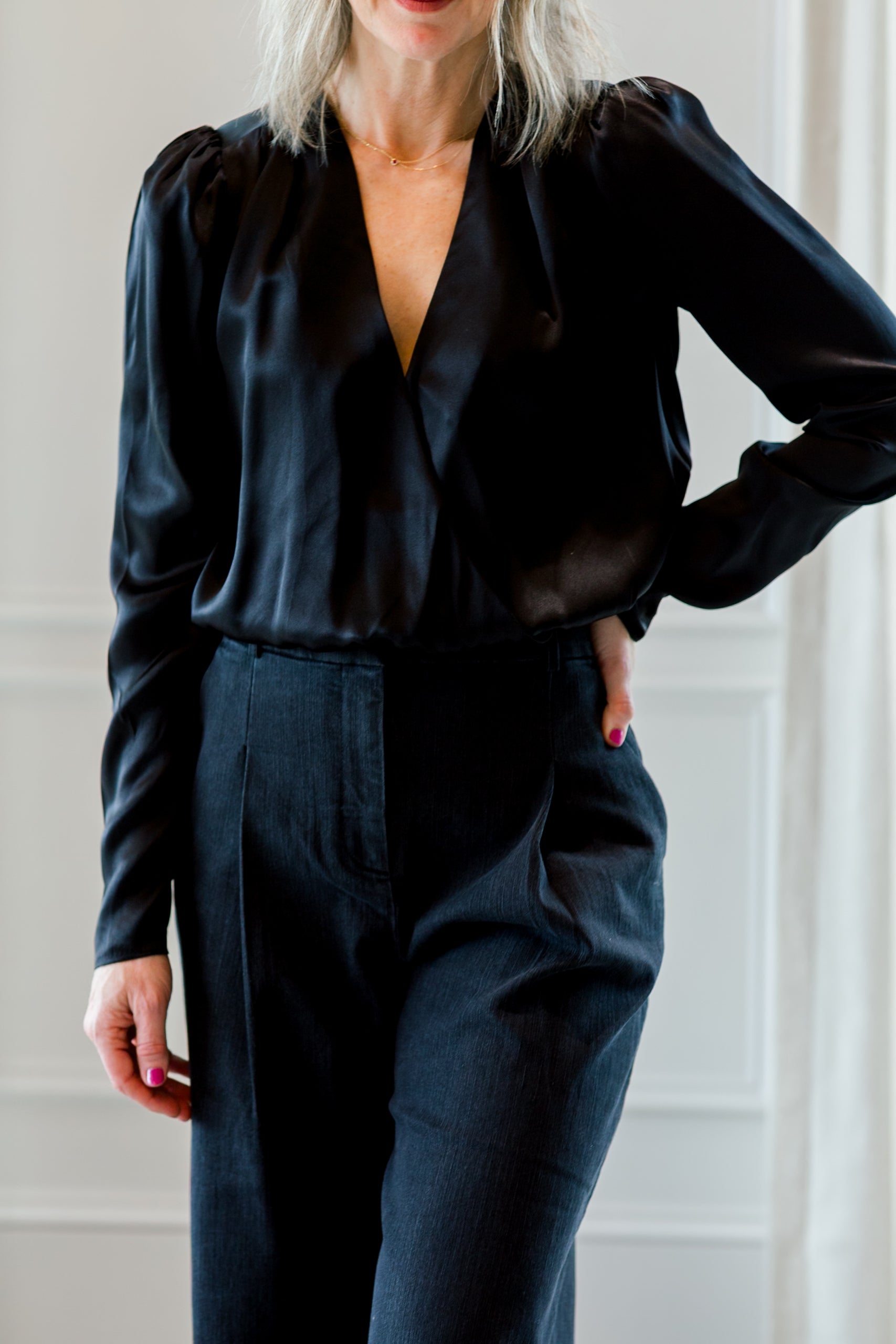 image of a woman wearing the garment catania blouse and merci anagram pants