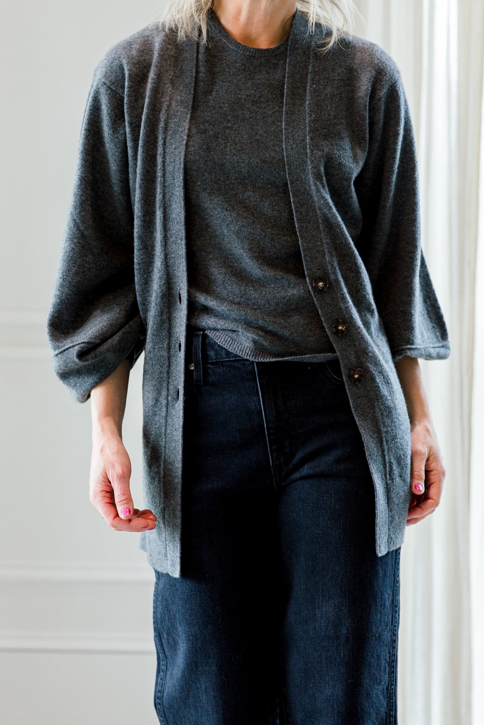 image of a woman wearing the garment como knit top and cardigan