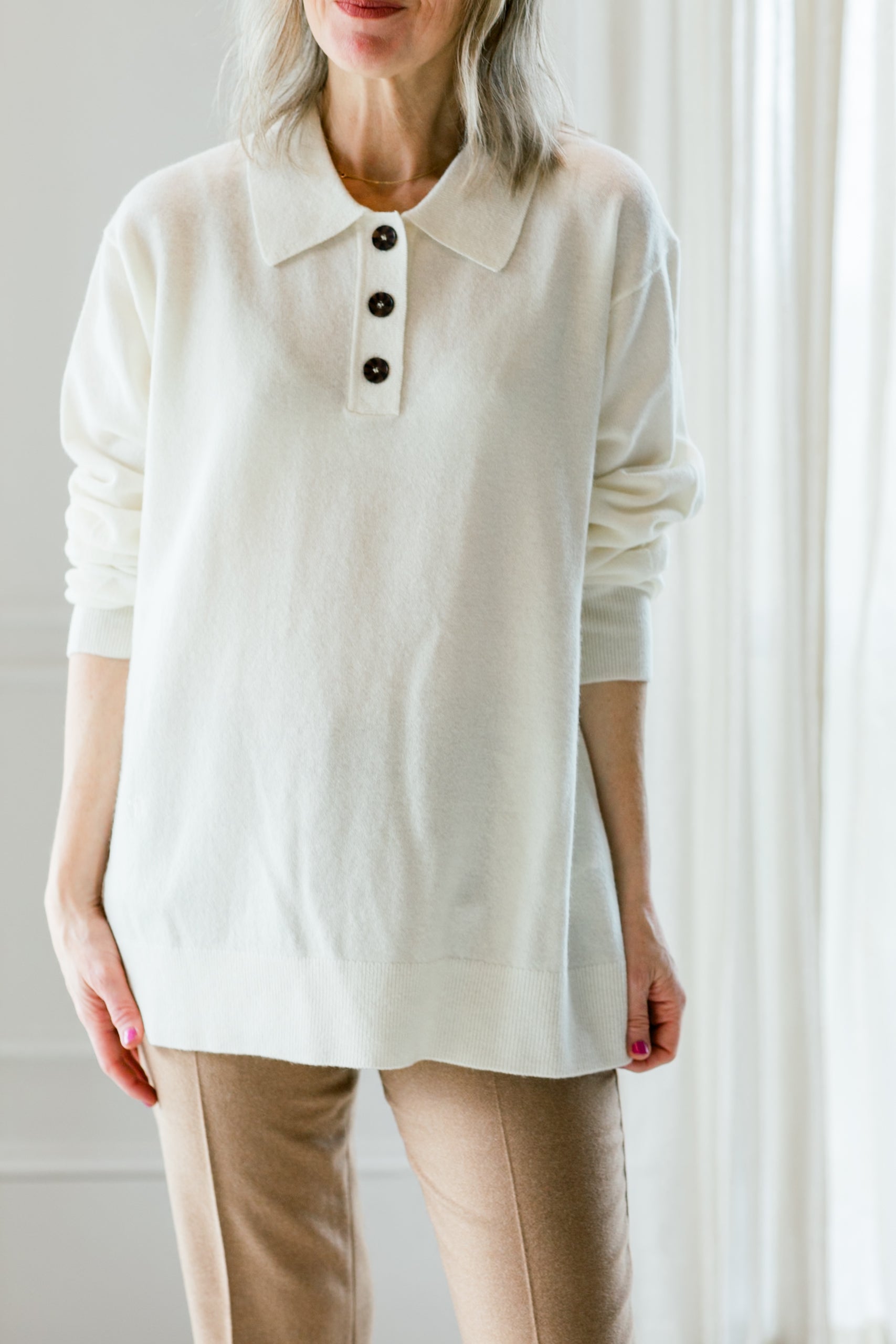 image of a woman wearing the garment polo sweater