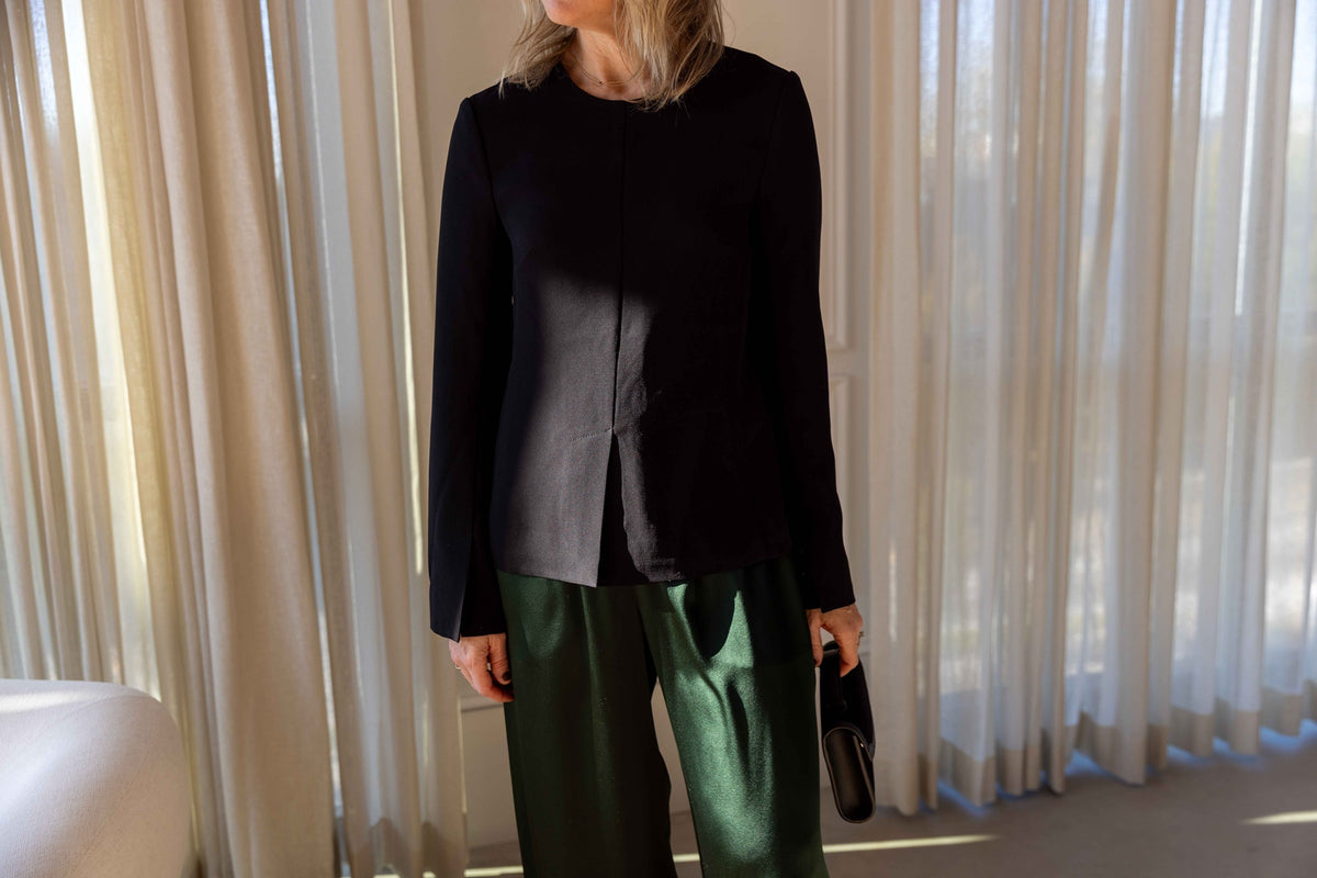The Garment Crepe Slit Blouse in Black styled with Sablyn Brynn pants and a Hunting Season handbag, view 1