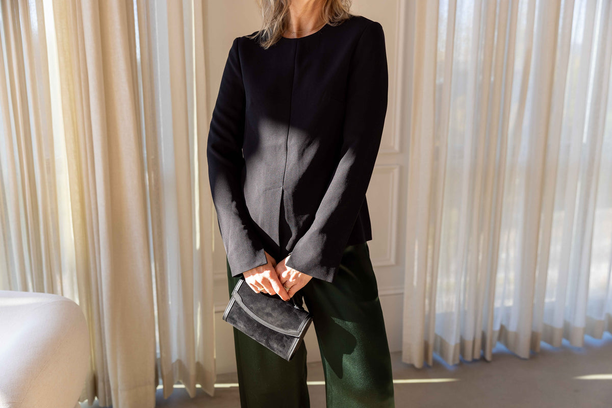 The Garment Crepe Slit Blouse in Black styled with Sablyn Brynn pants and a Hunting Season handbag, view 6