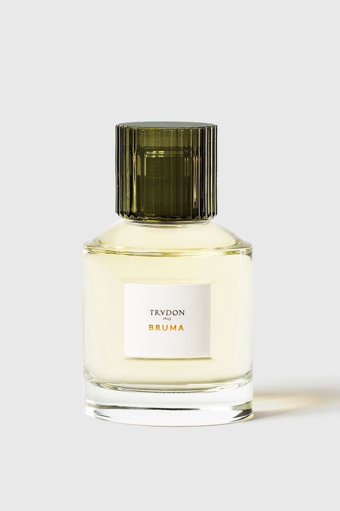 Perfume bottle labeled 'TRYDON BRUMA' on a white background